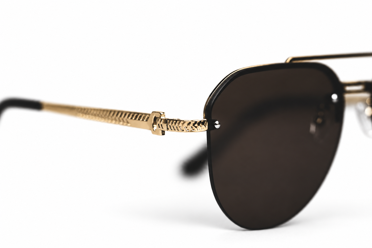 Classic Aviator sunglasses — gold temple detail on a white background