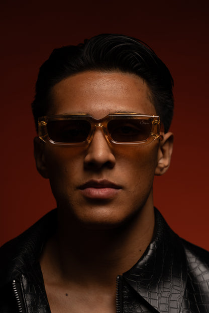 Emiliano wearing phantom sunglasses against original red background